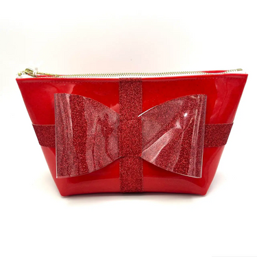 Cute red glittery bow coated in clear vinyl sewn onto red glitter infused vinyl made into a perfect pouch for makeup and cosmetics.