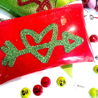 red and green heart and arrow card holder  clutches with custom m&ms on white background