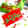 red and green heart and arrow card holder  clutches with custom m&ms on white background