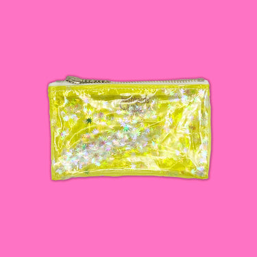 clear yellow vinyl bag filled with 420 friendly confetti keychain clutch cosmetic clutch by julie mollo and kush kards 